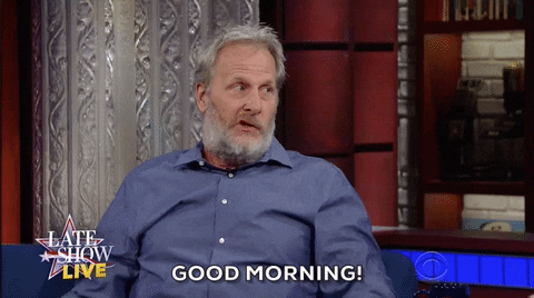 Celebrity gif. Jeff Daniels on the Late Show gives a side eye at the host and says, "Good Morning."