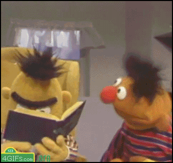 Muppets gif. Ernie smiles and bobs his head as Bert slowly looks up from a book and we zoom in on his stunned face.