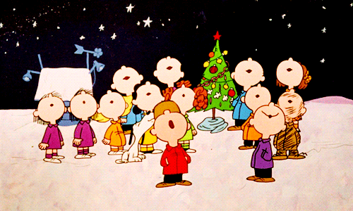 Peanuts gif. Children from A Charlie Brown Christmas singing outside as a chorus with their heads back.