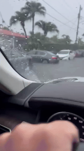 Cars Drive Through Floodwaters in South Florida During Heavy Rain
