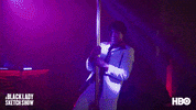 TV gif. Tommy Davidson in character on the Black Lady Sketch Show, dressed in a powder-blue suit, thrusting on a pole in the club.