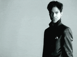 Celebrity gif. The artist formerly known as Prince walks across the frame shaking their head in disgust.