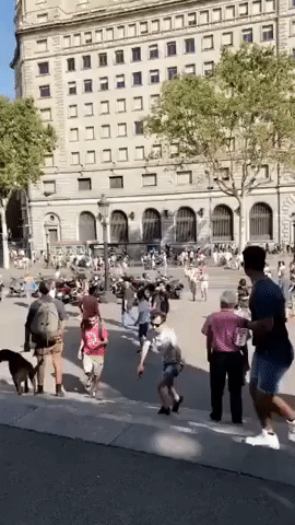 People Rush Down Barcelona Street After Van Crashes Into Pedestrians