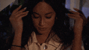 Reality TV gif. Victoria Fuller from The Bachelor, unhappy, brushes her hair back as she says, "Mmmmkay."