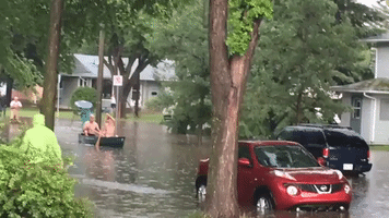 Saskatoon Residents Canoe Through Floodwater