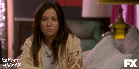 TV gif. Pamela Adlon as Sam Fox on Better Things sitting up in bed, looks fake-surprised and demonstrates restraint, saying, "oh."