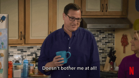 TV gif. Bob Saget as Danny on Fuller House. He jovially says, "Doesn't bother me at all!" while his mug explodes at the strain, revealing his lie.