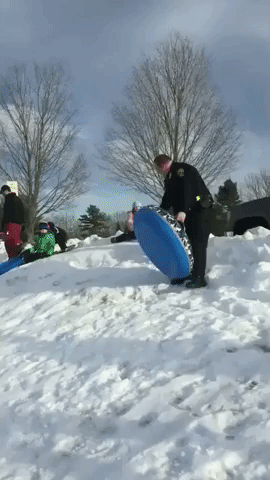 Six-Year-Old Twins Take on Maine Police Officer in Sled Race