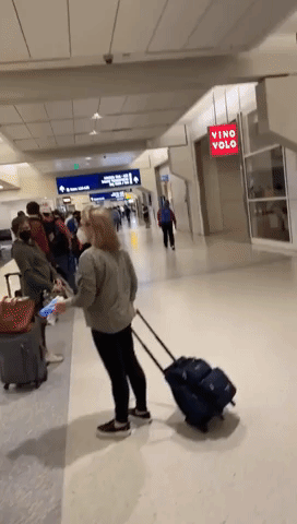 Delayed Travelers Form Long Line at Dallas Airport