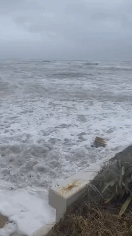 Waves Rush Into Parking Lot at Daytona Beach as Hurricane Nicole Reaches Florida