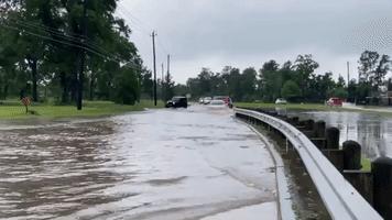 Vehicles Crawl Through High Floodwater in Houston, Texas
