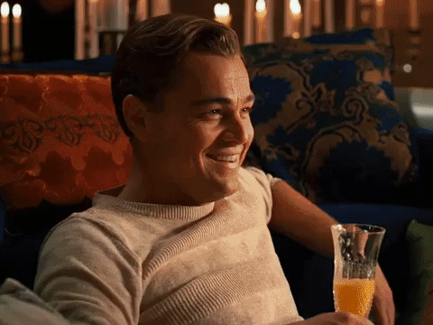 Movie gif. Clips of several famous male movie and tv characters laughing hysterically.
