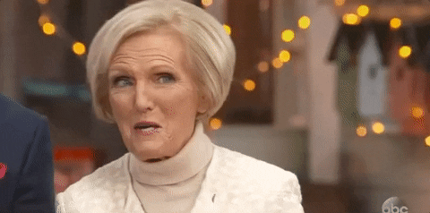 TV gif. Mary Berry on The Great American Baking Show licks her lips and says, “yum.”
