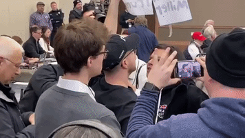 Trump Supporters Clash With Democrats at Michigan Representative's Town-Hall Meeting