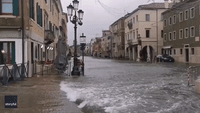 Santa Paddles Down Street as Venice Area Floods