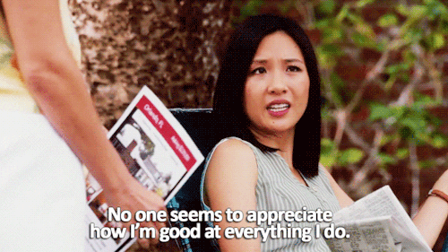 TV gif. Constance Wu as Jessica Huang on Fresh Off The Boat sits in a lawn chair with a newspaper in her hand as she says, “no one seems to appreciate how I'm good at everything I do.”