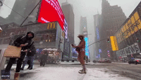 'Naked Cowboy' Takes Pictures With People in Times Square During Winter Storm