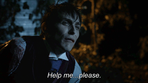 TV gif. Robin Lord Taylor as Oswald Cobblepot, aka The Penguin, on Gotham rocking back and forth and saying, "help me...please."