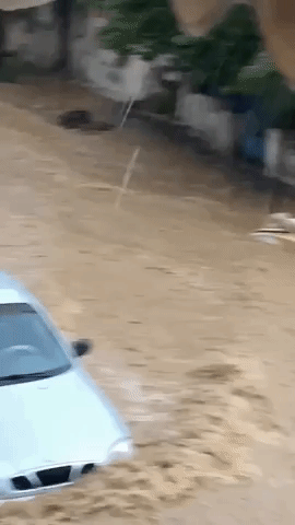 Debris Floats Down Roadways Amid Deadly Greek Flooding