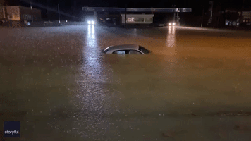 Car Barely Visible Above Floodwaters in Central Alabama