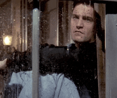 Friends gif. Matthew Perry as Chandler staring pensively out the window at the rain.