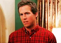 Movie gif. Wearing a red flannel shirt, Ryan Reynolds rolls his eyes and tilts his head back as if to say 