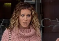 TV gif. Sarah Jessica Parker as Carrie on Sex and the City looks shocked and stunned as leans forward and her jaw drops. 