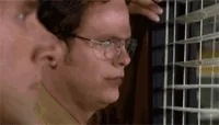 The Office Smirk GIF