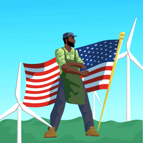 Illustrated gif. Man wearing a green apron and work boots stands in front of an American flag among spinning wind turbines. Text, "Clean energy independence now."