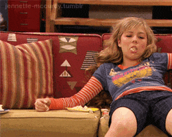 TV gif. Jennette McCurdy as Sam in iCarly seated on the couch, falls over dramatically, miming instantaneously falling asleep, uneaten potato chips falling out of her mouth.