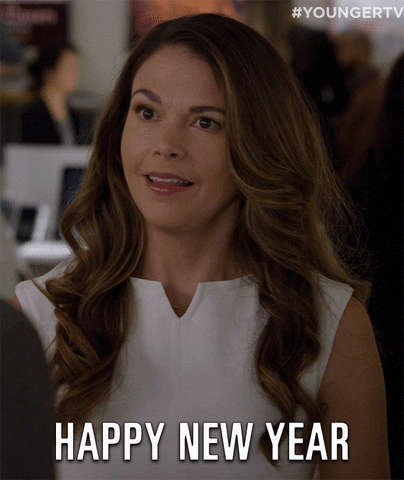 TV gif. Wearing a white sleeveless top, Sutton Foster as Liza from Younger gives us an impressed smile and wishes us a: Text, "Happy New Year."