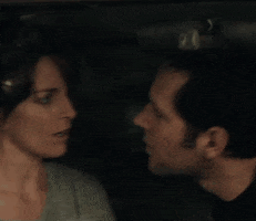 Movie gif. Paul Rudd as John cradles his hand around Tina Fey as Portia's neck in Admission as they lean in and kiss passionately.