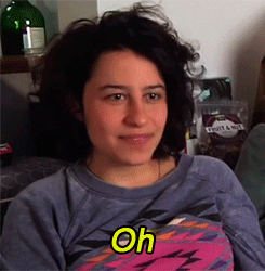 TV gif. Ilana Glazer as Ilana Wexler in Broad City. She's sitting on a couch and she pulls her chin in while saying, "oh," and gives a wry grin as she realizes something obvious.