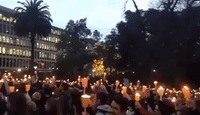 Melbourne Residents Hold Candle-lit Vigil to Welcome Refugees