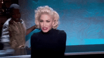 Music Video gif. Gwen Stefani dances and points at us before sliding away in her music video for Make Me Like You.
