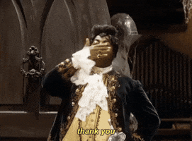 TV gif. Reginald VelJohnson as Carl on Family Matters blows a dramatic kiss as he stands in the doorway wearing a 19th-century vampire costume on Halloween night.