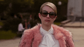 TV gif. Emma Roberts as Chanel in Scream Queens pouting and throwing her head back dramatically.