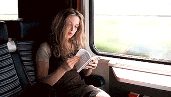 GENEZIZ reading book on the train GIF