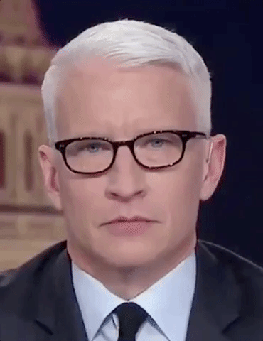 TV gif. A closeup of Anderson Cooper as he looks at us, blinks and rolls his eyes.  