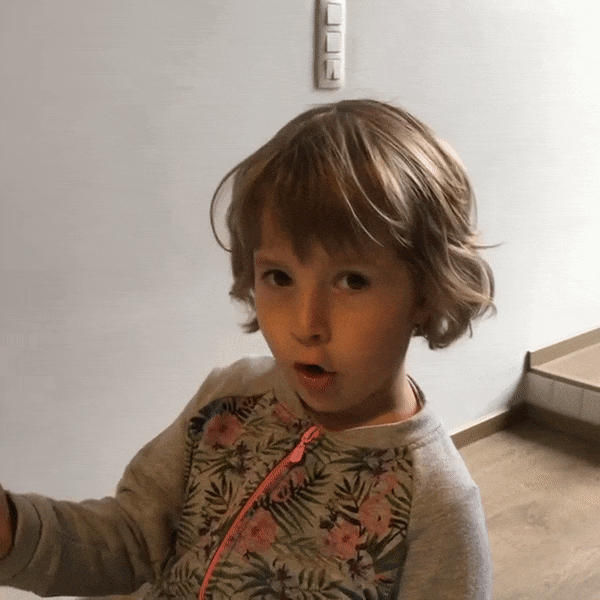 Video gif. A little girl in pajamas looks surprised, then smacks herself in the face and drops her head backward dramatically.