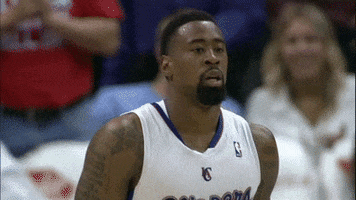 Sports gif. DeAndre Jordan from the Clippers is on the court and he walks by while scrunching his face, confused and in disbelief at what he's seeing.