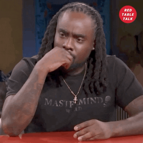 Celebrity gif. Wale on Red Table Talk chuckling and then dropping his head and laughing harder.