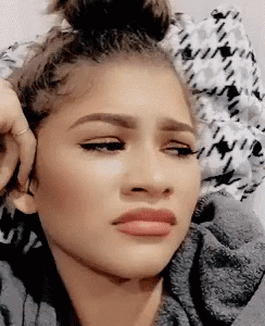 Celebrity gif. Close up on Actress Zendaya’s face. She’s in the corner of her eye with a look of disgust, then rolls her eyes.