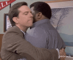 The Office gif. Ed Helms as Andy gives a tender hug to an unemotive Craig Robinson as Darryl Philbin. Darryl remains still as Andy rests his head on his shoulder.