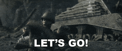 Video game gif. Soldiers scramble with their weapons on a battle field as one says, "Let's go!," before a plane flies overhead.