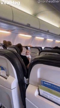 Baby's Got an Intense Glare on Airplane